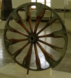A spoked wheel on display at The National Museum of Iran, in Tehran. The wheel is dated late 2nd millennium BC and was excavated at Choqa Zanbil.