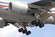 Main undercarriage of an American Airlines 777-200ER while on an approach to land
