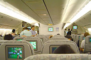 Economy class interior of EVA Air 777 featuring the Star Gallery in-flight entertainment system