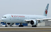 An Air Canada 777-300ER with thrust reversers and spoilers deployed