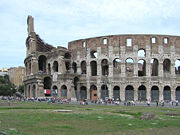 The exterior of the Colosseum, showing the partially intact outer wall (left) and the mostly intact inner wall (right)