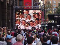 A large crowd of over 10,000 fans welcome the Australian team on completing the first World Cup hat-trick - Martin Place, Sydney.
