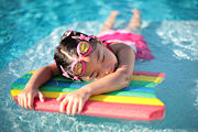 Floatation aids such as this styrofoam board can help children learn to swim.
