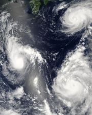 Three tropical cyclones at different stages of development. The weakest (left), demonstrates only the most basic circular shape. A stronger storm (top right) demonstrates spiral banding and increased centralization, while the strongest (lower right) has developed an eye.