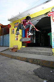A skater performs a kickflip.