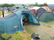 A stream runs through one unfortunate punter's tent after two inches of rain were dropped in an hour on Friday morning of the 2005 festival.