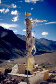 A prayer flag above Tanze Monastery in the Kurgiakh Valley. The wind is believed to propagate the prayers printed on tissue.
