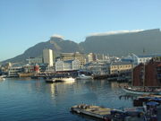 The Victoria & Alfred Waterfront in Cape Town with Table Mountain in the background. Cape Town has become an important retail and tourism centre for the country, and attracts the largest number of foreign visitors in South Africa