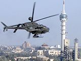 A U.S. Army helicopter flying by Baghdad's tower