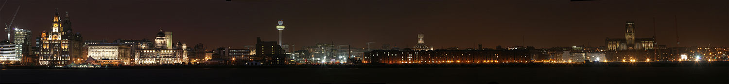 Liverpool waterfront by night, as seen from the Wirral is a UNESCO World Heritage site