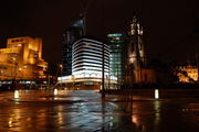 The Parish Church of St. Nicholas and the Atlantic Tower hotel near Pier Head. The Atlantic Tower was designed to resemble the prow of a ship to reflect Liverpool's maritime history