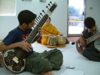 A boy is mending a Sitar in Islamabad