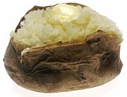 A baked potato served with butter