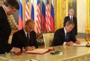 Vladimir Putin and George Bush signing SORT