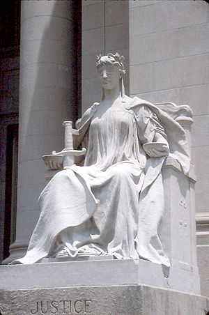 Lady Justice or Justitia is a personification of the moral force that underlies the legal system (particularly in Western art). Her blindfold symbolises equality under the law through impartiality towards its subjects, the weighing scales represent the balancing of people's interests under the law, and her sword denotes the law's force of reason and the power of the sovereign to enforce the law.