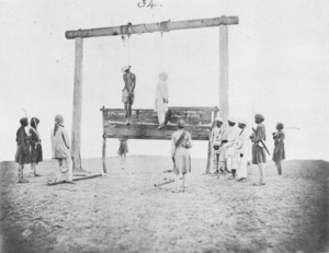 The hanging of two participants in the Indian Rebellion of 1857. Albumen silver print by Felice Beato, 1858