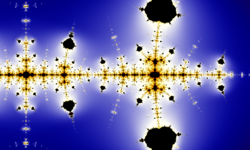 The Collatz conjecture: one way to illustrate its complexity is to extend the iteration from the natural numbers to the complex numbers. The result is a fractal, which (in accordance with universality) resembles the Mandelbrot set.