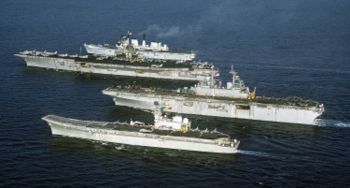 Four aircraft carriers, (bottom-to-top) Principe de Asturias, amphibious assault ship USS Wasp, USS Forrestal and light V/STOL carrier HMS Invincible, showing size differences of late 20th century carriers