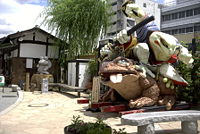 A frog and lizard battle in this contemporary sculpture in Matsumoto, Japan.