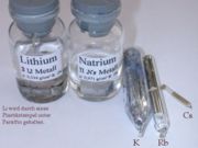 Series of alkali metals, stored in mineral oil (note "natrium" is sodium.)