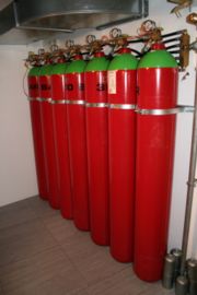 Canisters containing argon gas for use in extinguishing fire without damaging server equipment
