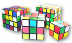 Variations of Rubik's Cubes (from left to right: Rubik's Revenge, Rubik's Cube, Professor's Cube, & Pocket Cube (also known as "Mini-Cube")).