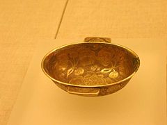 A Chinese Tang Dynasty (618–907 CE) gilt-silver cup with flower design