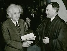 Albert Einstein receiving his certificate of American citizenship from Judge Phillip Forman in 1940.