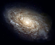 NGC 4414, a typical spiral galaxy in the constellation Coma Berenices, is about 56,000 light years in diameter and approximately 60 million light years distant.