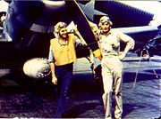 Ensign George Gay (right), sole survivor of VT-8's TBD Devastator group, in front of his aircraft, 4 June 1942.
