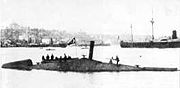 Nordenfelt-designed Ottoman submarine Abdülhamid (1886) was the first submarine in the world to fire a torpedo while submerged. It and its sister ship, Abdülmecid (1887), were built in pieces by Des Vignes (Chertsey) and Vickers (Sheffield) in England, and were assembled at the Taşkızak Naval Shipyard in Istanbul, Turkey.