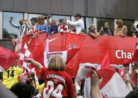 Arsenal's players and fans celebrate their 2004 League title win with an open-top bus parade.