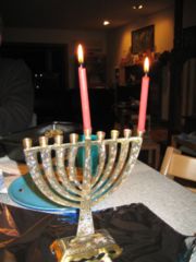 A menorah with two lit candles