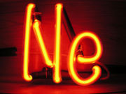Neon is often used in signs and produces an unmistakable bright orange colored light. All other colors (though still referred to as "neon") are created using a mercury vapor discharge which excites a phosphor via fluorescence, or by the other Noble Gases.