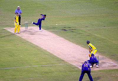 Muttiah Muralitharan who has been routinely heckled by Australian crowds, bowling in a One Day International against Australia at Brisbane in early 2006.