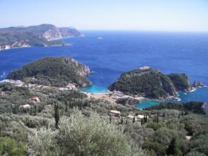The bay of Palaiokastritsa in Corfu as seen from Bella vista of Lakones. Corfu is considered to be the mythical island of the Phaeacians. The bay of Palaiokastritsa is considered to be the place where Odysseus disembarked and met Nausicaa for the first time. The rock in the sea visible near the horizon at the top centre-left of the picture is considered by the locals to be the mythical petrified ship of Odysseus. The side of the rock toward the mainland is curved in such a way as to resemble the extended sail of a trireme