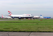 Queue of aircraft for take-off including jets from Virgin Atlantic Airways, British Airways, Air India, and bmi
