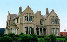 "Castlamore", Lovelock Avenue, Dunedin, designed by F. W. Petre. This Gothic house merely hints at a castle theme, and has none of the Gothic gloom and sobriety of the small lancet windows and turrets generally associated with the style.