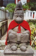 Simian statue at a Buddhist shrine in Tokyo, Japan.