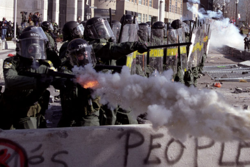 Police fire tear gas at protesters in Quebec.