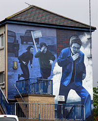 Bogside Artists' mural of a boy running from CS gas in Derry.