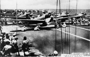 Japanese fighter and dive bomber aircraft on Shokaku prepare to launch for an attack on U.S. carrier forces the morning of October 26, 1942.