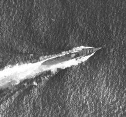 Japanese cruiser Chikuma under attack on October 26.  The white spot in the center of the ship is where one of the 1,000-pound bombs hit directly on the bridge, causing heavy damage and high casualties.