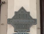 A marker along The Strand indicating a building that survived the 1900 hurricane