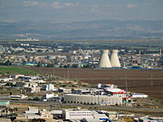 The oil refinery in Haifa, Israel is capable of processing about 9 million tons (66 million barrels) of crude oil a year.  Its two cooling towers are landmarks of the city's skyline.