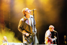Singer Liam Gallagher (left) and guitarist Noel Gallagher of Oasis, live in 2005