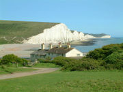 The Seven Sisters cliffs and the lifeboat cottages, from Seaford Head showing Cuckmere Haven (looking East)