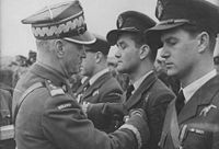 General Sikorski decorates pilots of the Polish 303rd Squadron, the most combat-effective Allied squadron in the Battle of Britain. Here he decorates ace Jan Zumbach.