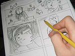 An artist sketching out a comics page