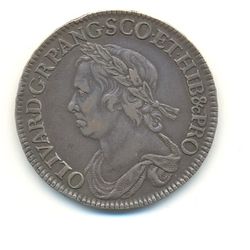 Half-Crown coin of Oliver Cromwell, 1658. The Latin inscription reads: OLIVAR.D.G.RP.ANG.SCO.ET.HIB&cPRO         (OLIVARIUS DEI GRATIA REIPUBLICAE ANGLIAE SCOTIAE ET HIBERNIAE ET CETERORUM PROTECTOR), meaning "Oliver, by the Grace of God Protector of the Commonwealth of England, Scotland and Ireland and other (territories)".